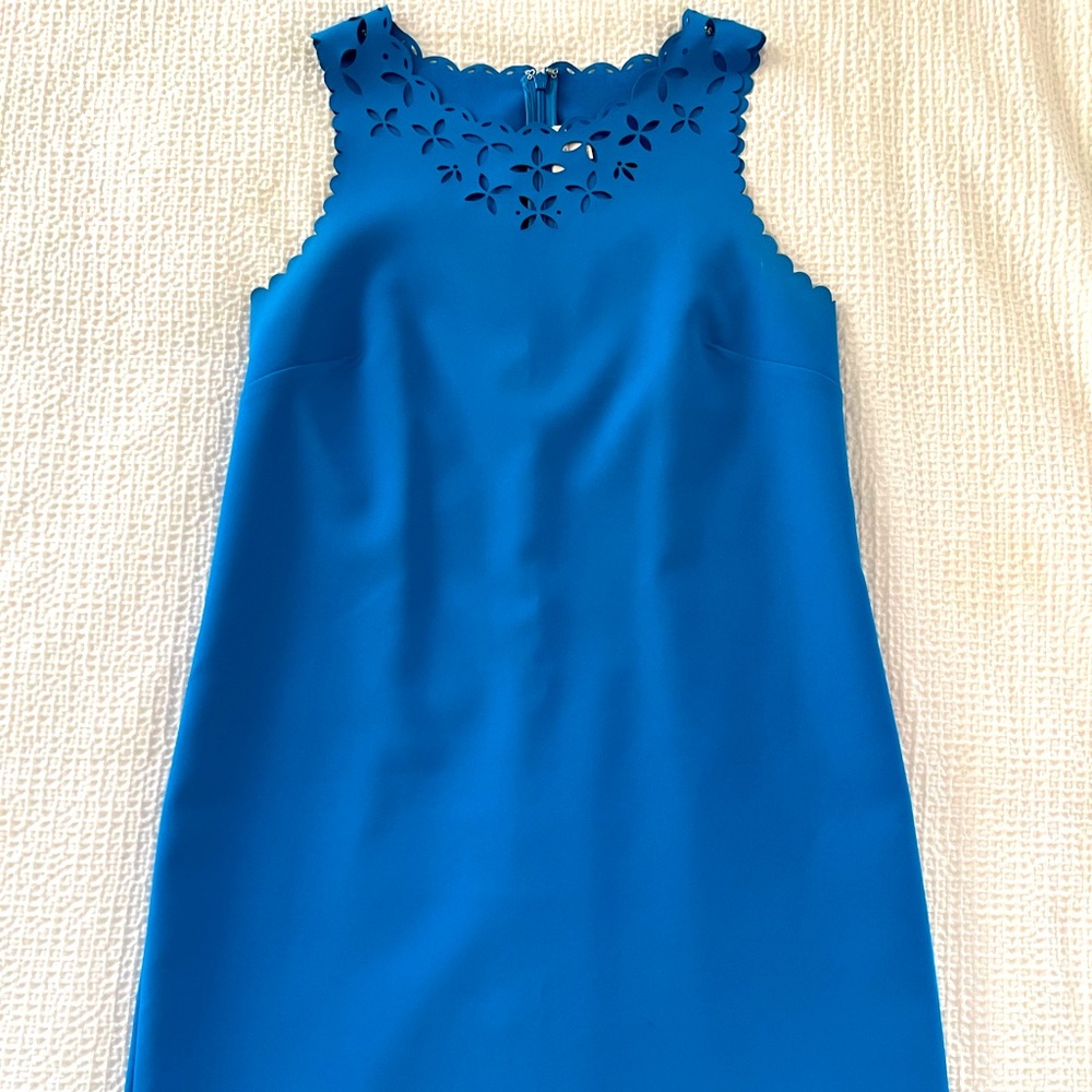 J Crew bright blue dress with die cut details.